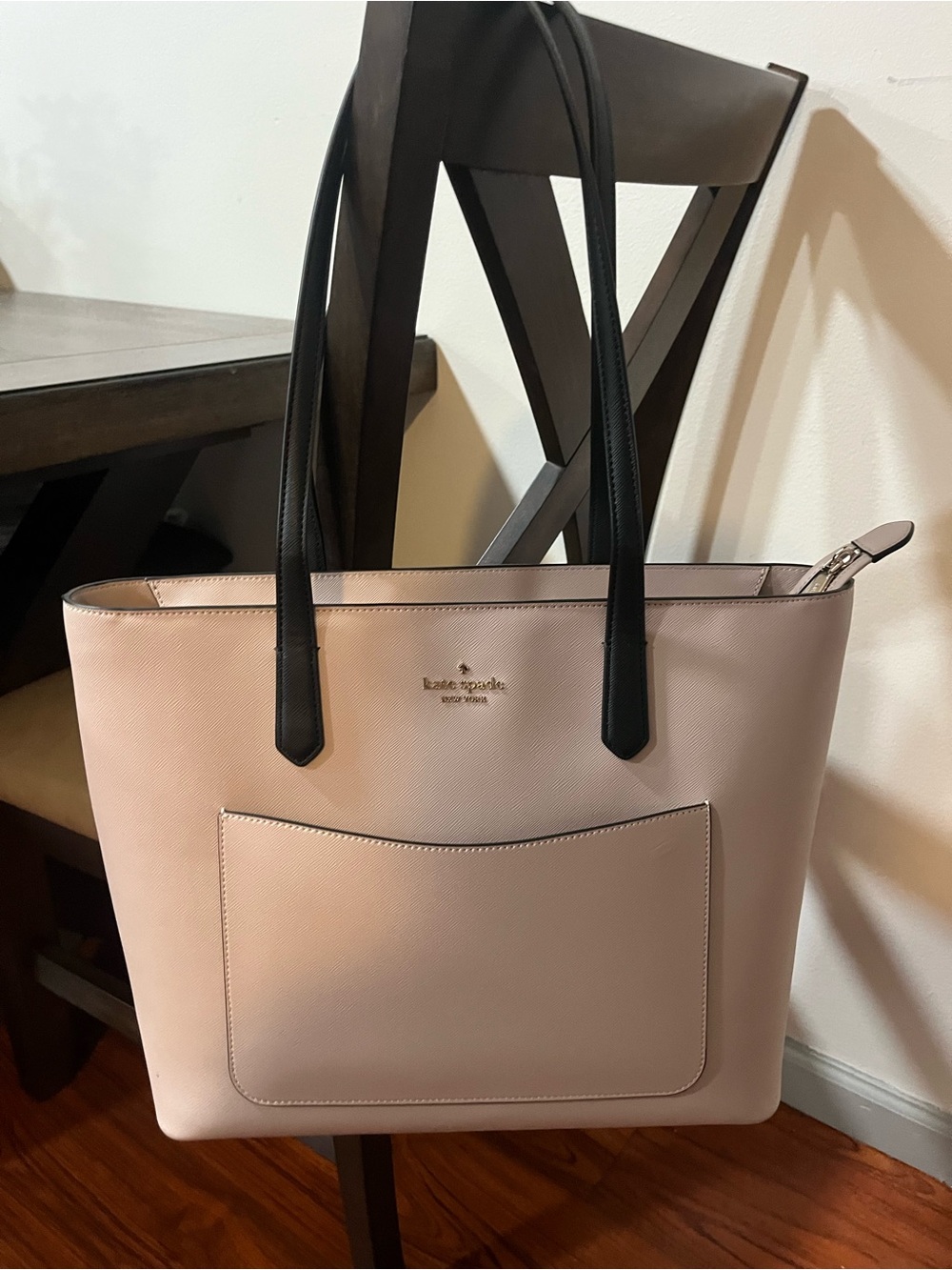 kate spade cream colored tote with black straps. Never used